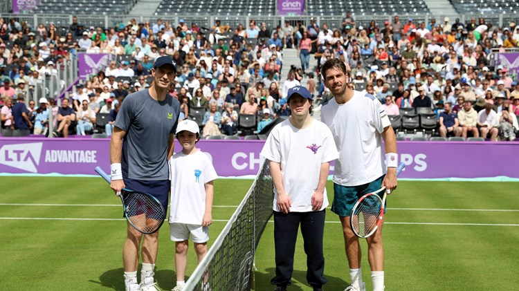 Andy Murray and Cam Norrie on court with kids linked to the LTA Tennis Foundation at the cinch Championships