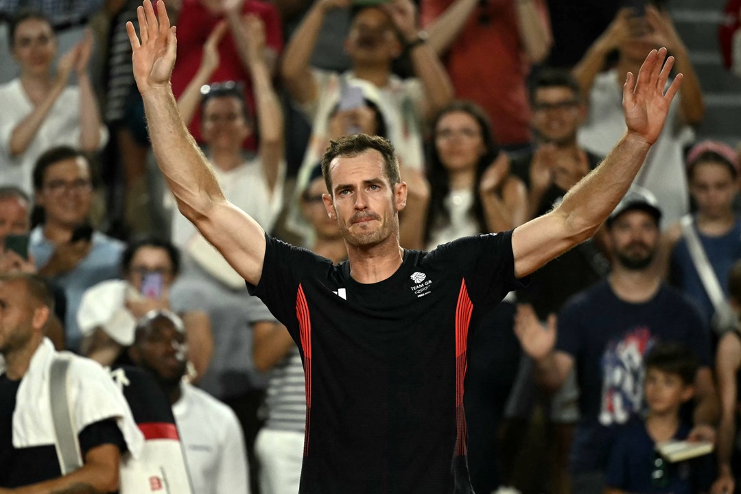 Andy Murray waves to the crowd one final time after his final match at the Olympics