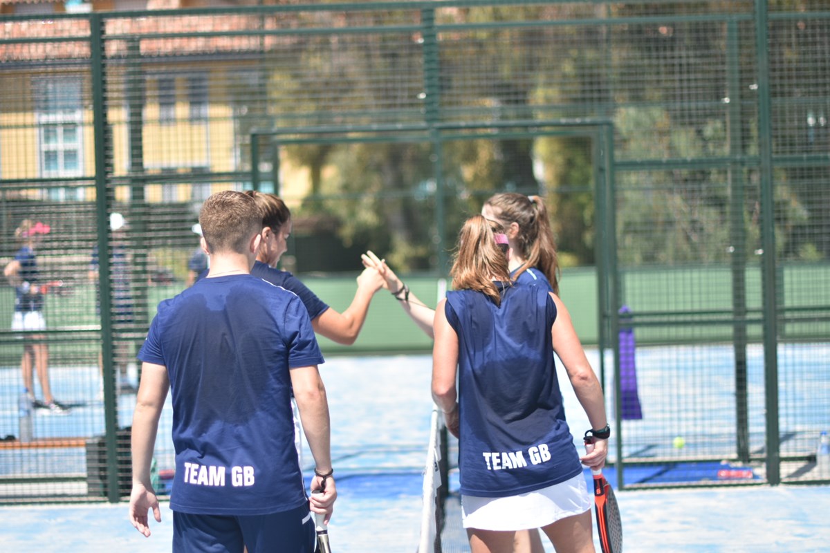 Four Team GB padel players at the net shaking hands