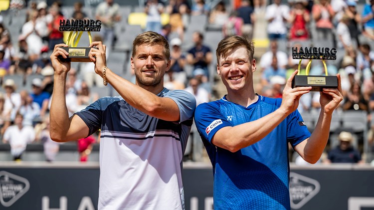 Lloyd Glasspool and Harri Heliovaara celebrate winning the Men's Double Final during day nine of the Hamburg European Open 2022