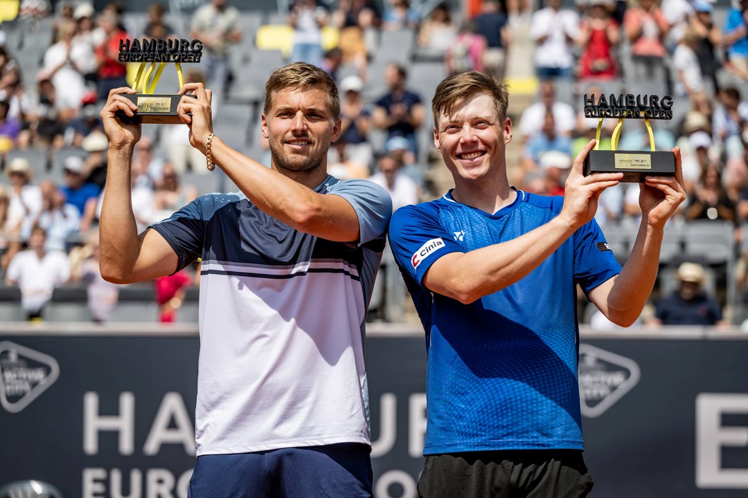 Lloyd Glasspool and Harri Heliovaara celebrate winning the Men's Double Final during day nine of the Hamburg European Open 2022