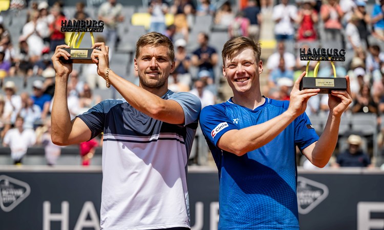 Lloyd Glasspool and Harri Heliovaara celebrate winning the Men's Double Final during day nine of the Hamburg European Open 2022