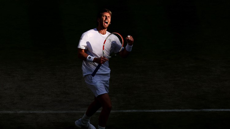 Cam Norrie celebrates a point against David Goffin during their men's singles quarter-final match on day nine of The Championships Wimbledon 2022 