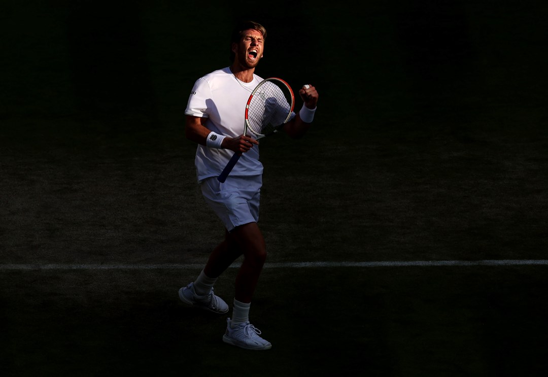 Cam Norrie celebrates a point against David Goffin during their men's singles quarter-final match on day nine of The Championships Wimbledon 2022