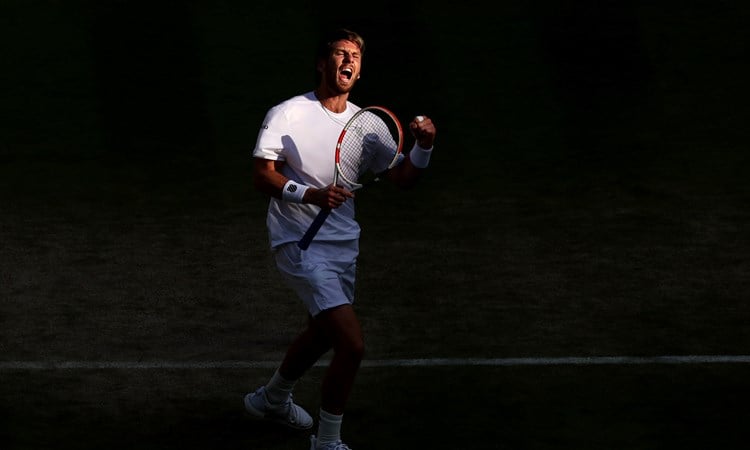 Cam Norrie celebrates a point against David Goffin during their men's singles quarter-final match on day nine of The Championships Wimbledon 2022 