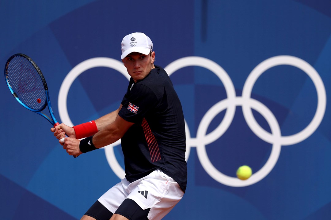 Jack Draper lines up a backhand in the opening round of the Olympics