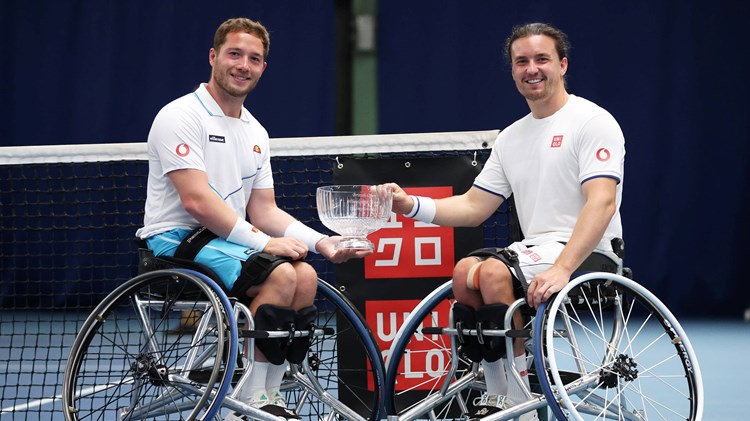 Alfie Hewett and Gordon Reid of Great Britain pose for a photo with the winners trophy after victory over Martin de la Puente of Spain and Gustavo Fernandez of Argentina in the men's doubles final during the Lexus British Open Wheelchair Tennis Championships at Lexus Nottingham Tennis Centre on August 05, 2023 in Nottingham, England.