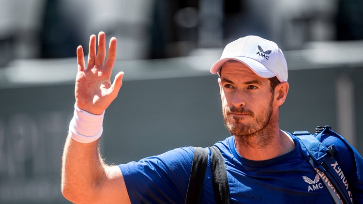 Andy Murray waves to the fans as he walks off court
