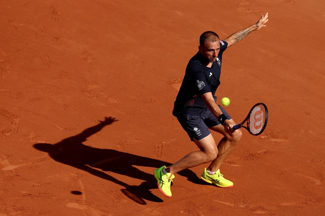 Dan Evans hits a backhand in the second round at the Olympics