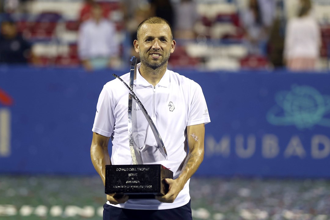 Dan Evans holding the 2023 Citi Open title