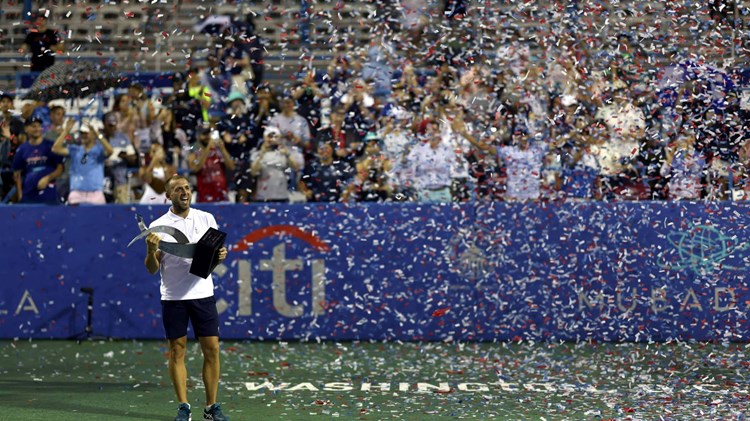 Dan Evans holding the 2023 Citi Open title