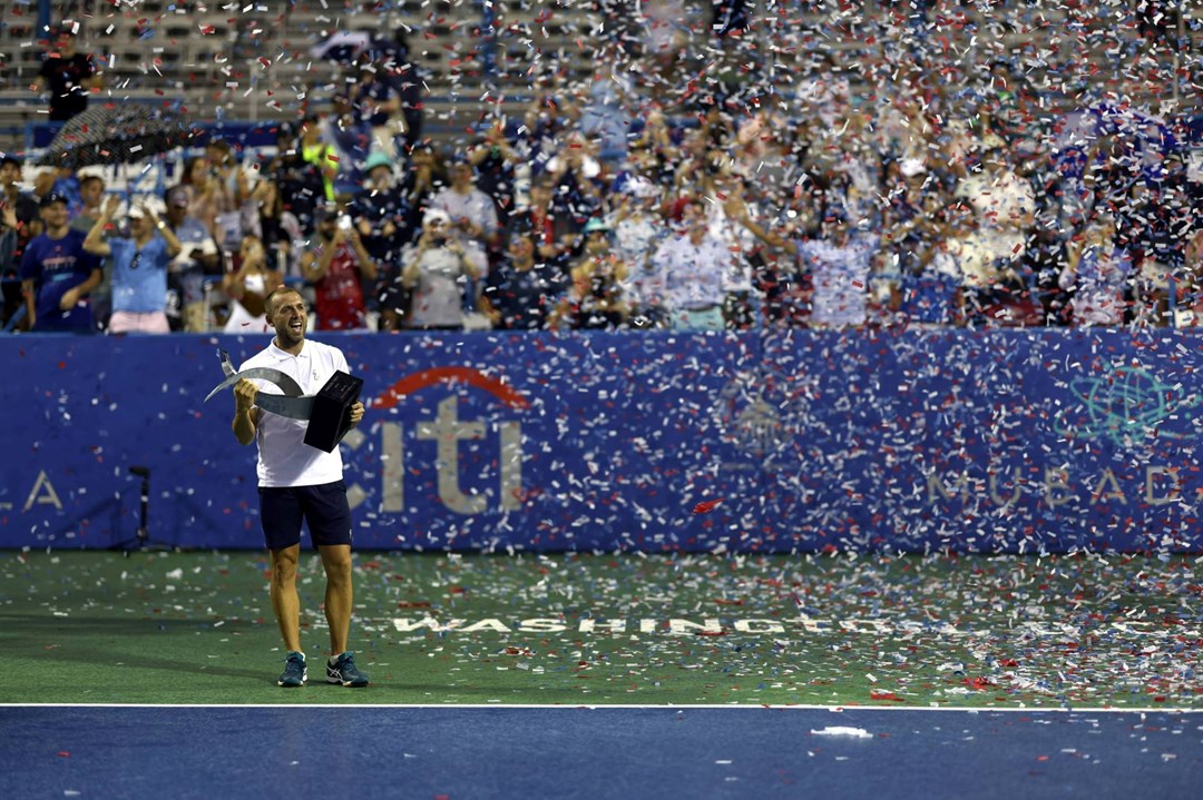 Dan Evans holding the 2023 Citi Open title