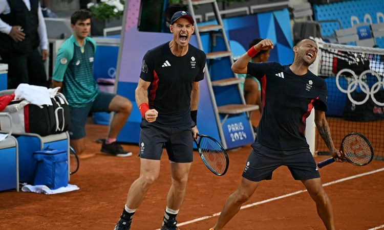 Andy Murray and Dan Evans celebrate their opening round win at the Olympics