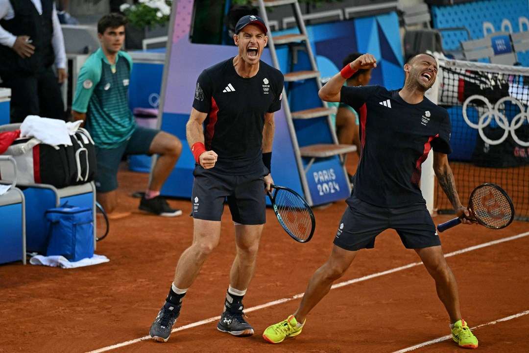 Andy Murray and Dan Evans celebrate their opening round win at the Olympics