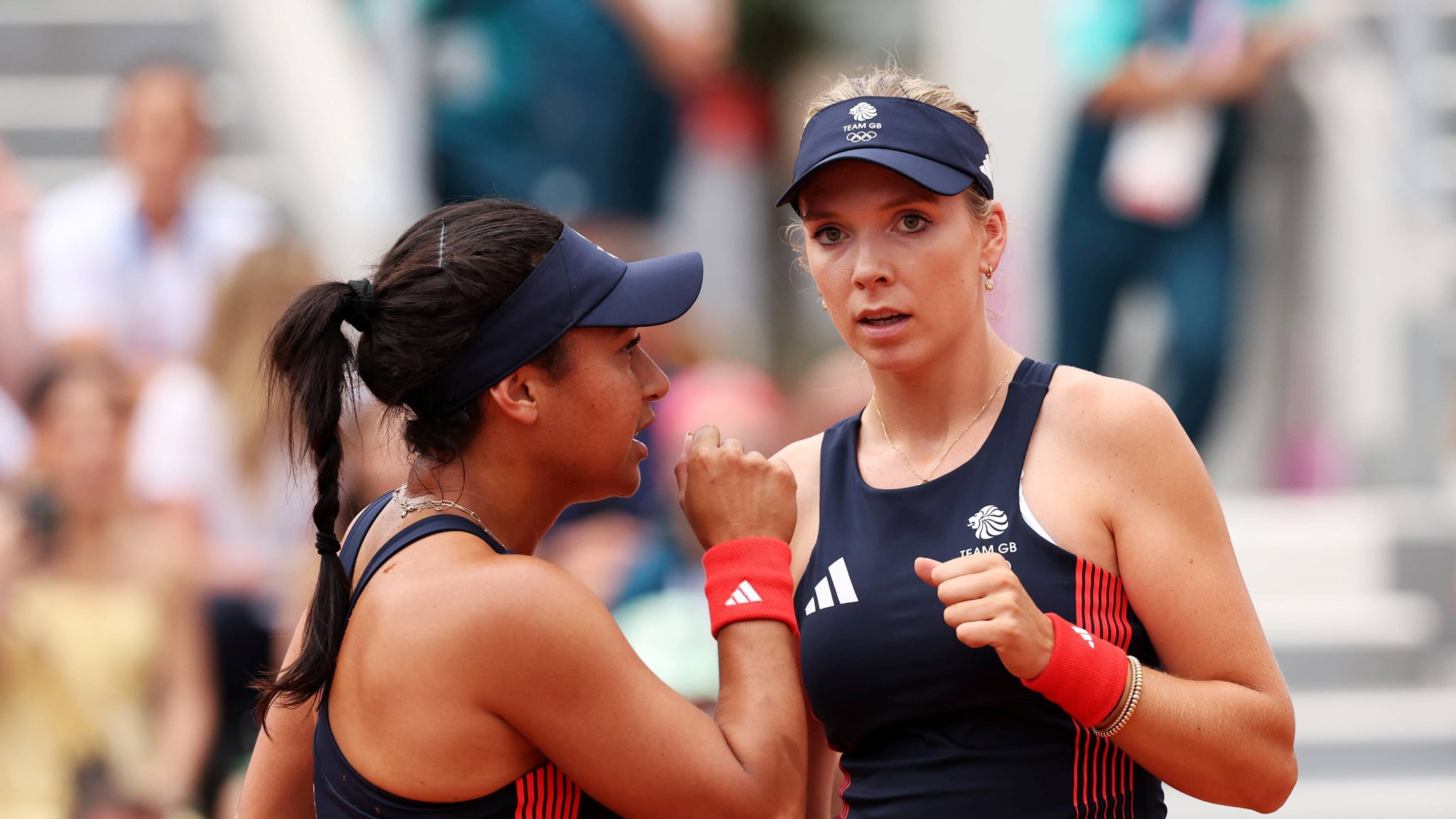Heather Watson and Katie Boulter interacting on courtt during the women's doubles at the Olympics