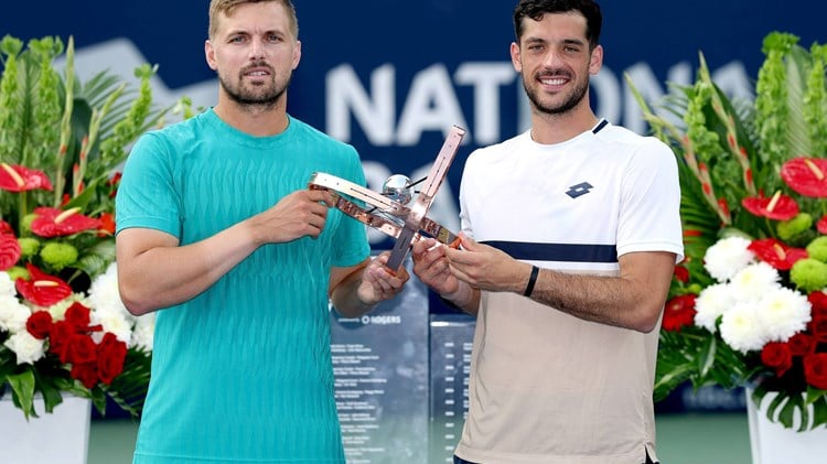 Lloyd Glasspool and Julian Cash holding the National Bank Open title in Toronto