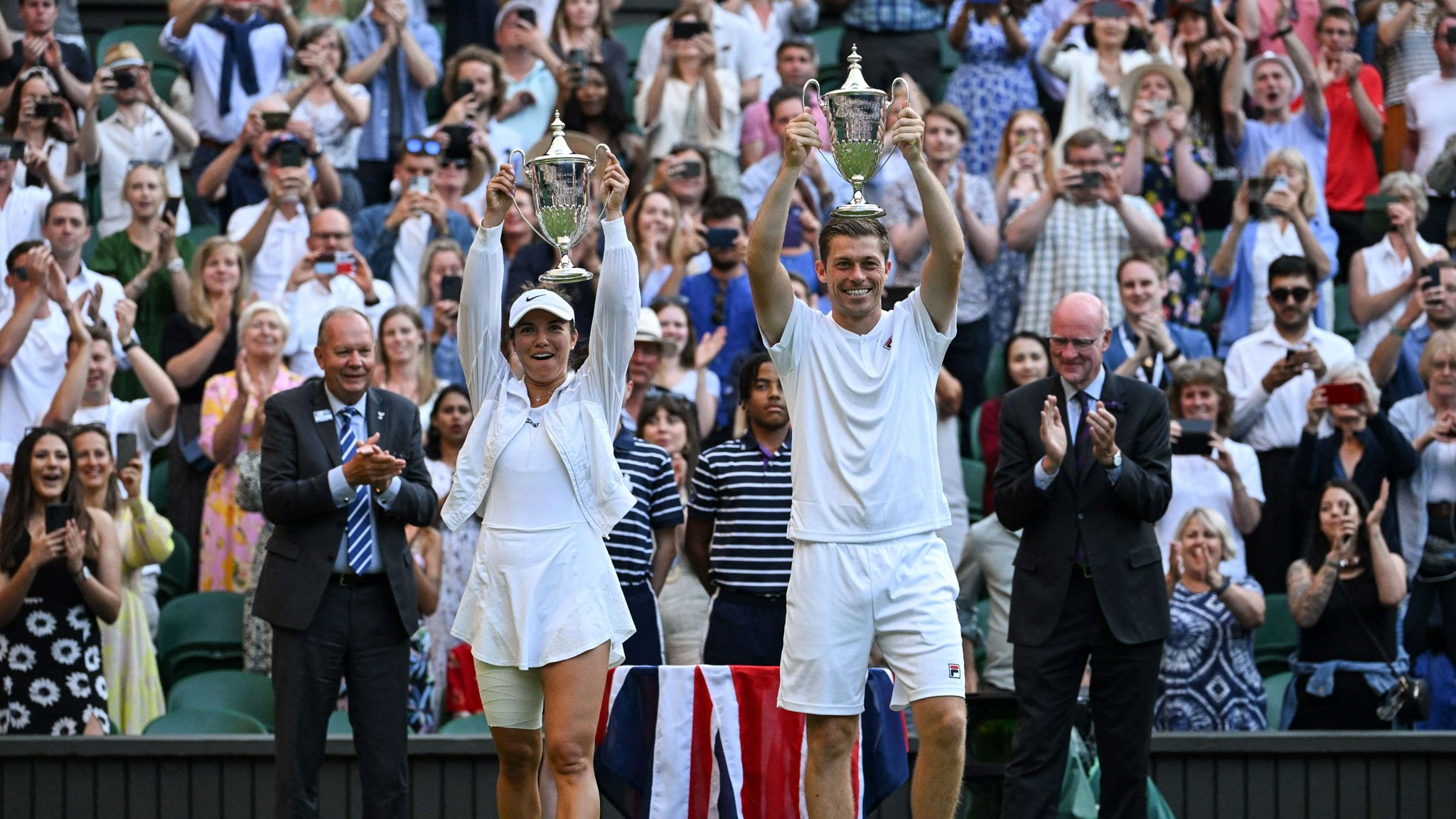 Neal Skupski and Desirae Krawczyk with the 2022 Wimbledon mixed doubles title