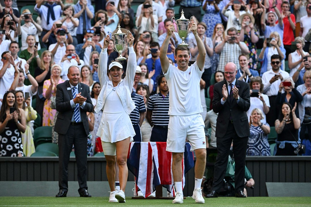 Neal Skupski and Desirae Krawczyk with the 2022 Wimbledon mixed doubles title