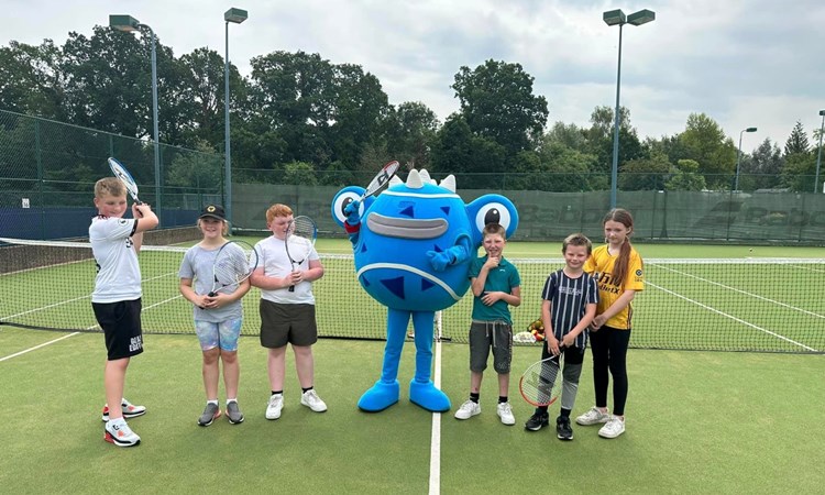 The Achieving Goalz and Dreams tennis group pictured with one of the six Tennisables on the Edgbaston Priory Club practice courts at the Rothesay Classic Birmingham 2023