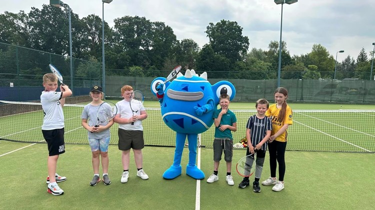 The Achieving Goalz and Dreams tennis group pictured with one of the six Tennisables on the Edgbaston Priory Club practice courts at the Rothesay Classic Birmingham 2023