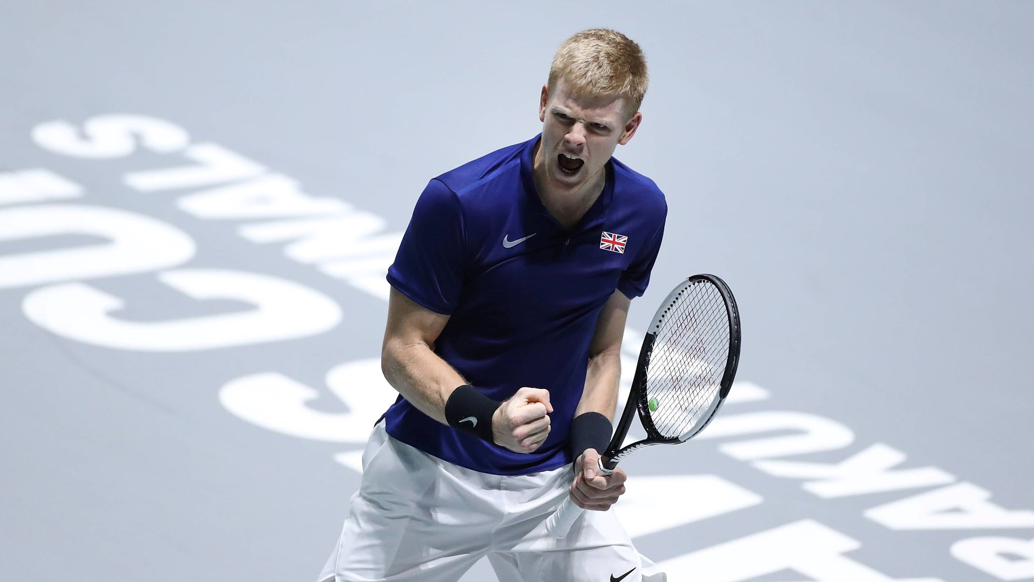 Lyle Edmund celebrates winning against Feliciano Lopez at the 2019 Davis Cup Finals