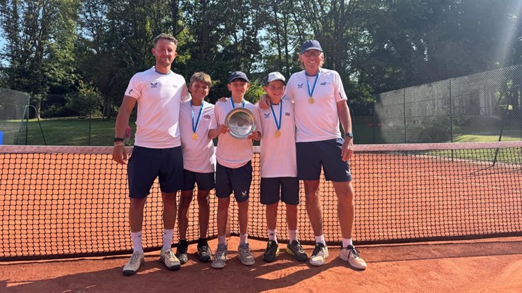 The GB 12U boys' team holding the 2025 Summer Cup trophy