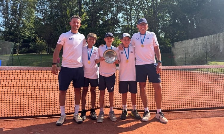 The GB 12U boys' team holding the 2025 Summer Cup trophy