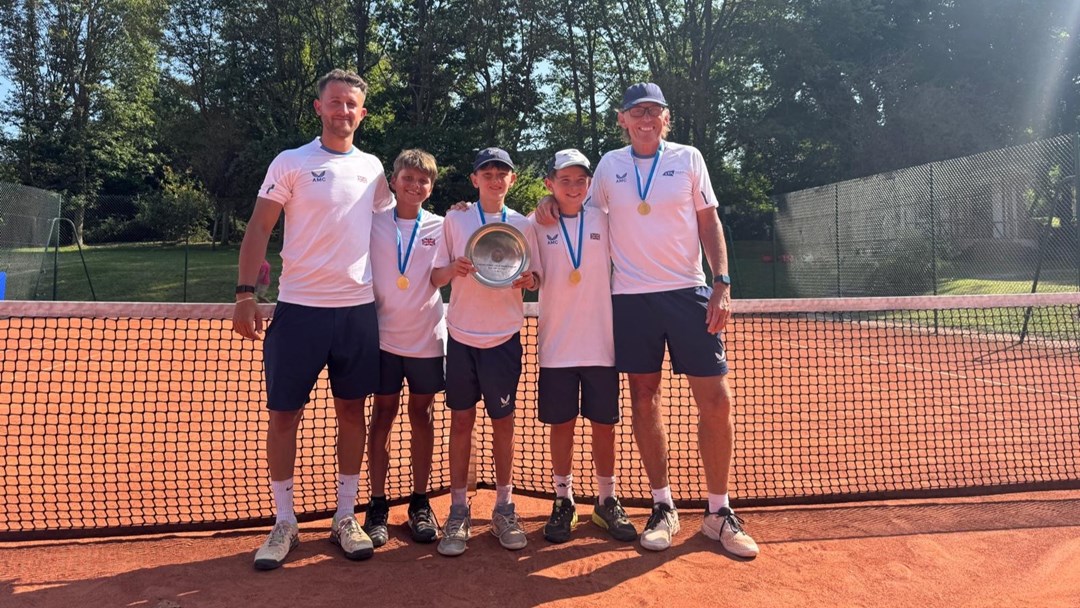 The GB 12U boys' team holding the 2025 Summer Cup trophy