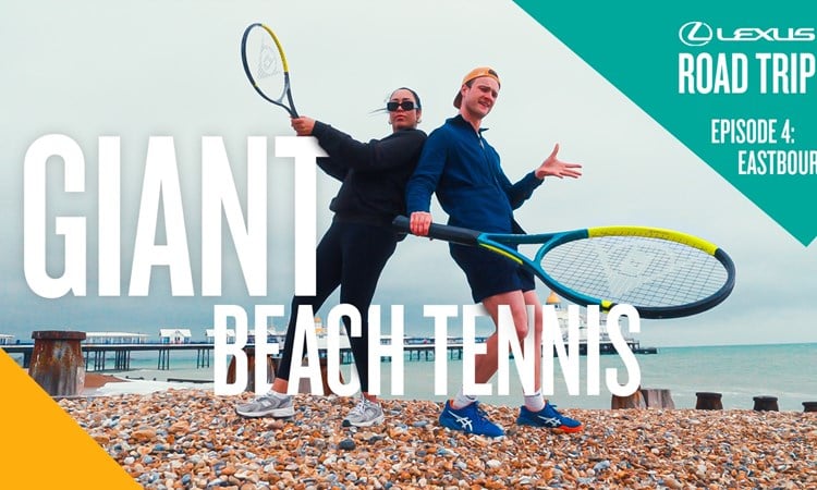 Snoochie Shy and Josh Berry pose with a huge tennis racket on Eastbourne beach