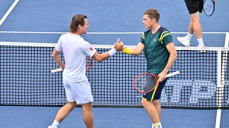 Neal Skupski and Wesley Koolhof high five at the National Bank Open 