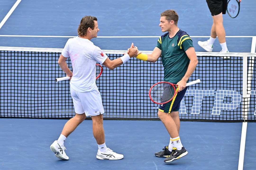 Neal Skupski and Wesley Koolhof high five at the National Bank Open