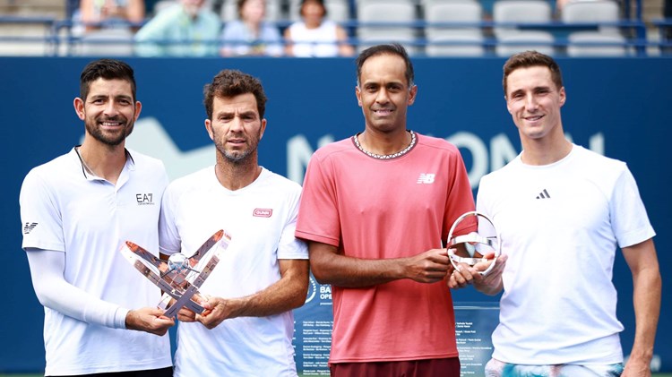 Joe Salisbury & Rajeev Ram holding the National Bank Open runners-up trophy next to champions Marcelo Arevalo & Jean-Julien Rojer
