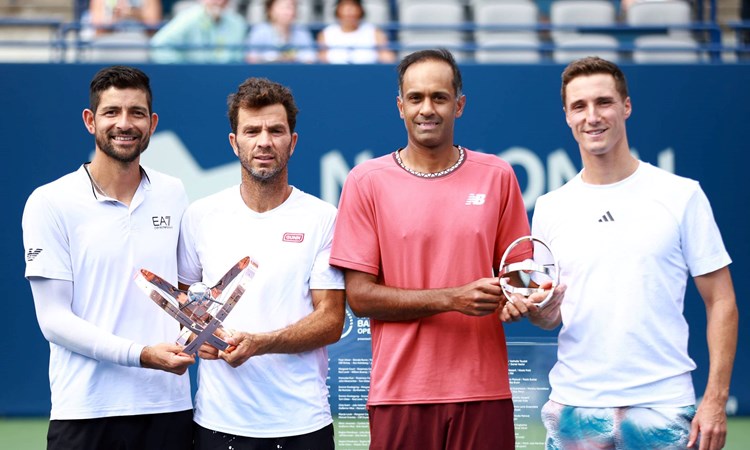 Joe Salisbury & Rajeev Ram holding the National Bank Open runners-up trophy next to champions Marcelo Arevalo & Jean-Julien Rojer