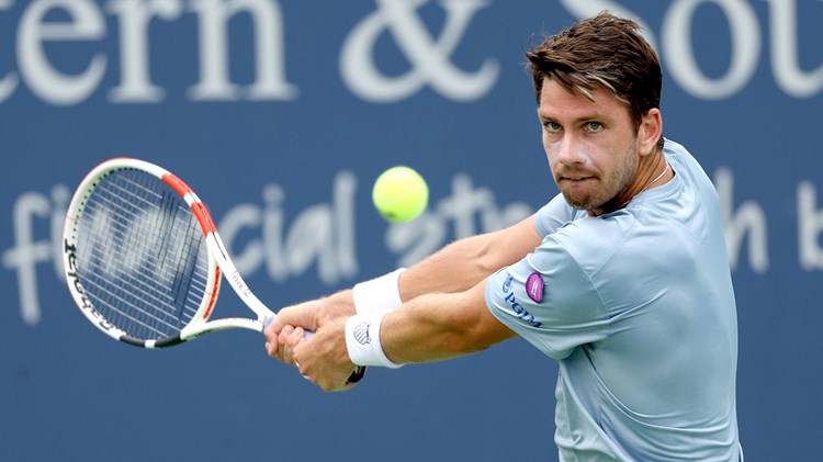 Cam Norrie focusing on the ball as he's about to hit a backhand at the Western & Southern Open