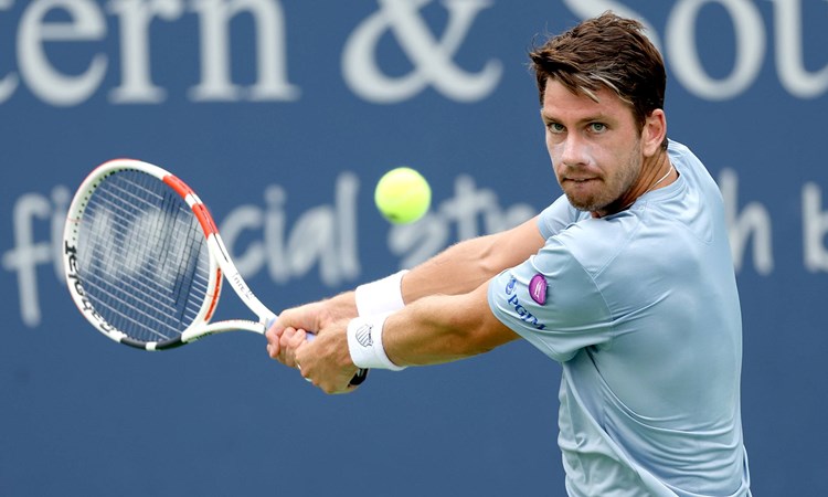 Cam Norrie focusing on the ball as he's about to hit a backhand at the Western & Southern Open