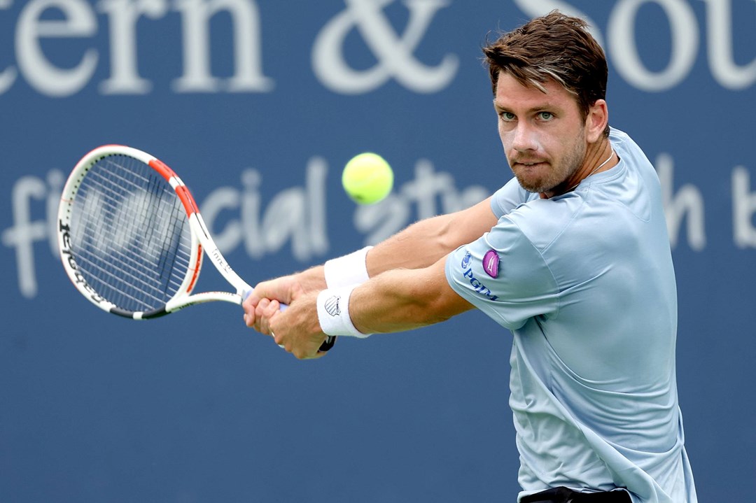 Cam Norrie focusing on the ball as he's about to hit a backhand at the Western & Southern Open