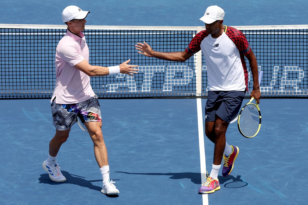 Joe Salisbury and Rajeev Ram interacting during their second round match at the Western & Southern Open 2022
