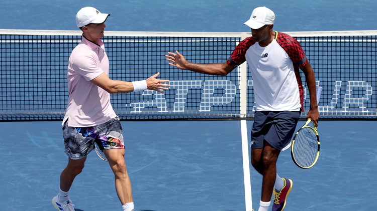 Joe Salisbury and Rajeev Ram interacting during their second round match at the Western & Southern Open 2022