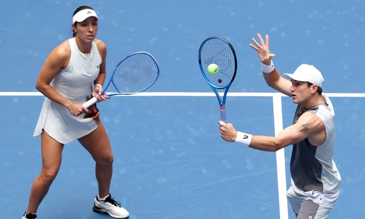 Jack Draper volleying during the US Open mixed doubles