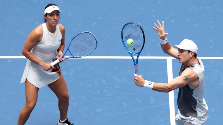 Jack Draper volleying during the US Open mixed doubles