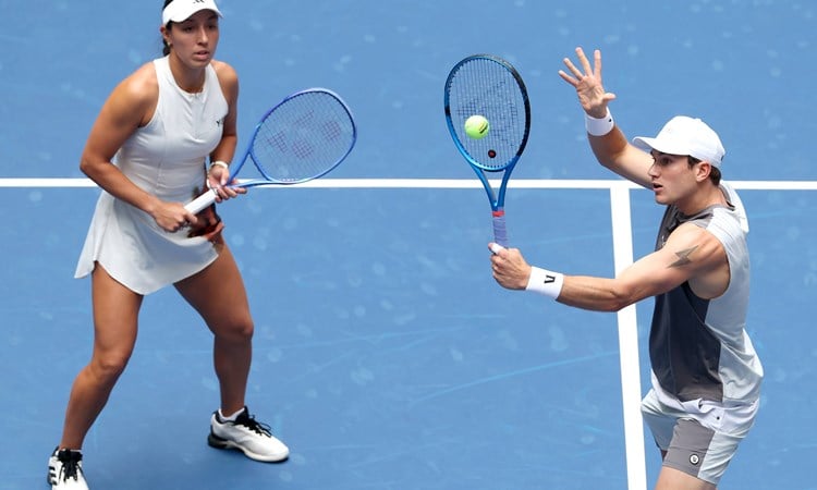 Jack Draper volleying during the US Open mixed doubles