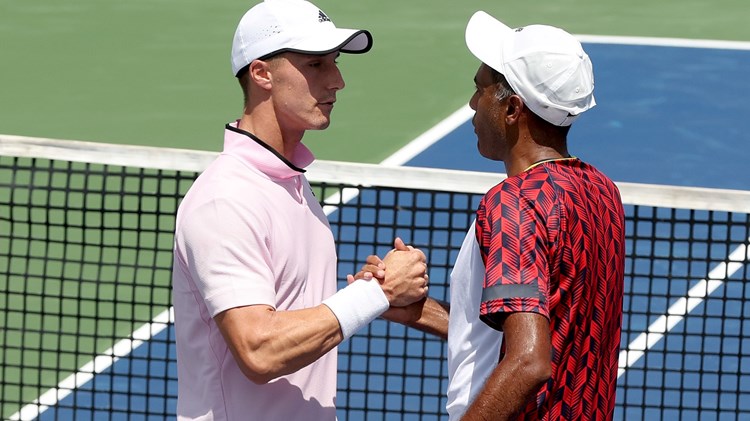 Joe Salisbury and Rajeev Ram interacting during their first round match at the 2022 Western & Southern Open