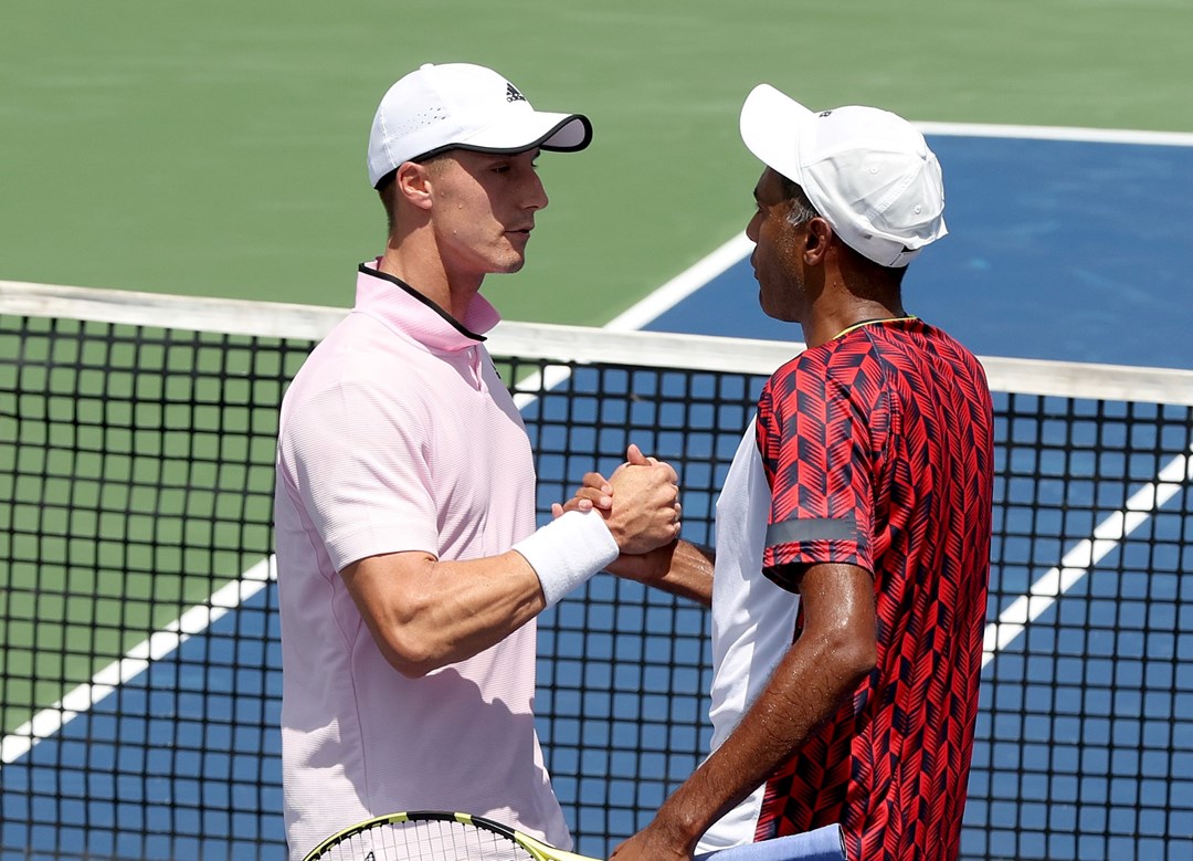 Joe Salisbury and Rajeev Ram interacting during their first round match at the 2022 Western & Southern Open