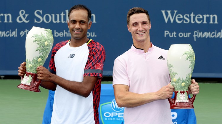 Rajeev Ram and Joe Salisbury pose for photographers after the men's doubles final of the Western & Southern Open at Lindner Family Tennis Center