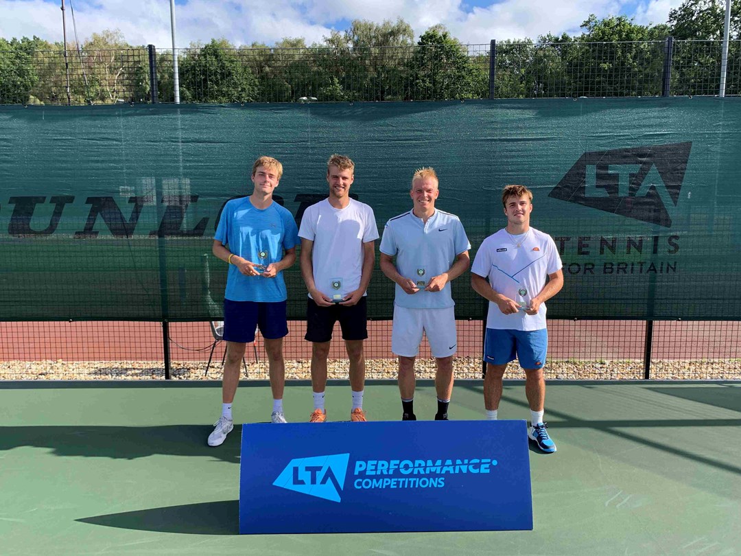 Johannus Monday and Emile Hudd holding their championship trophies next to Anton Matusevich and Arthur Fery at the M25 Aldershot event