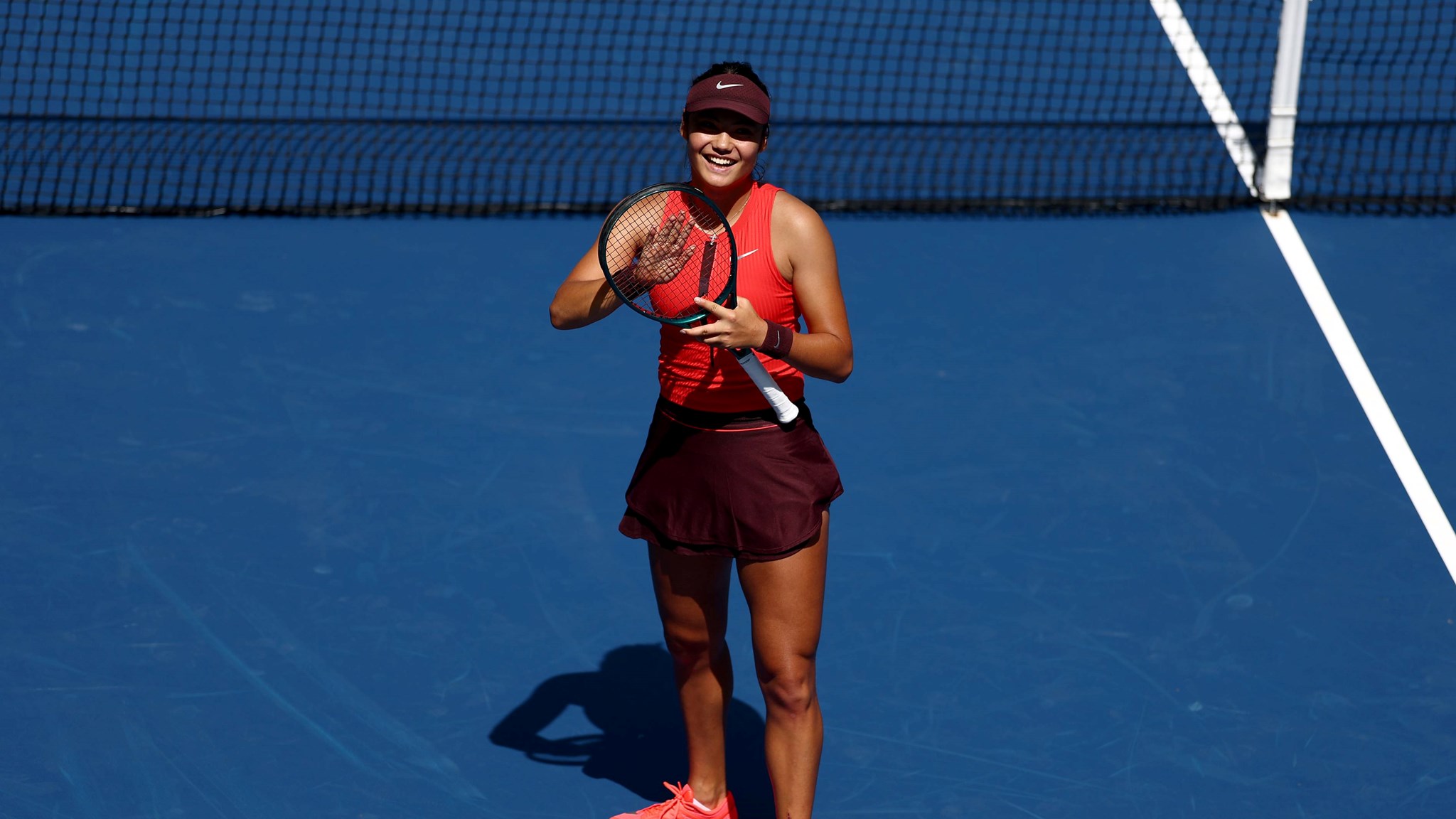 Emma Raducanu applauds the crowd after a first round win at the 2025 US Open