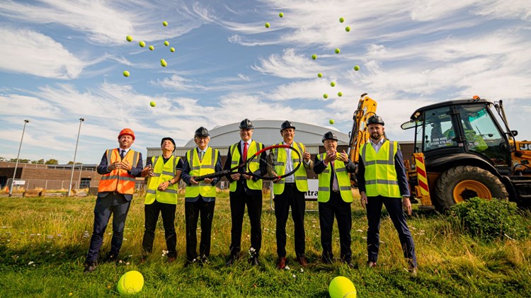 Builders on the construction site of the new indoor tennis courts at Oriam