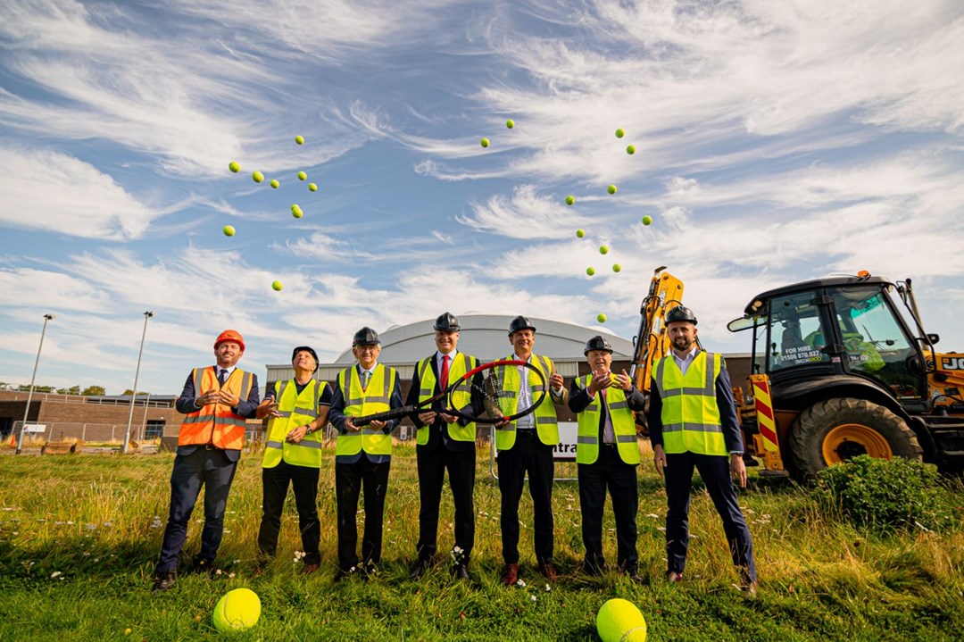 Builders on the construction site of the new indoor tennis courts at Oriam