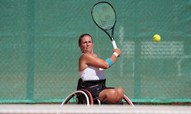 Lucy Shuker hitting a backhand in practice at the Paralympics