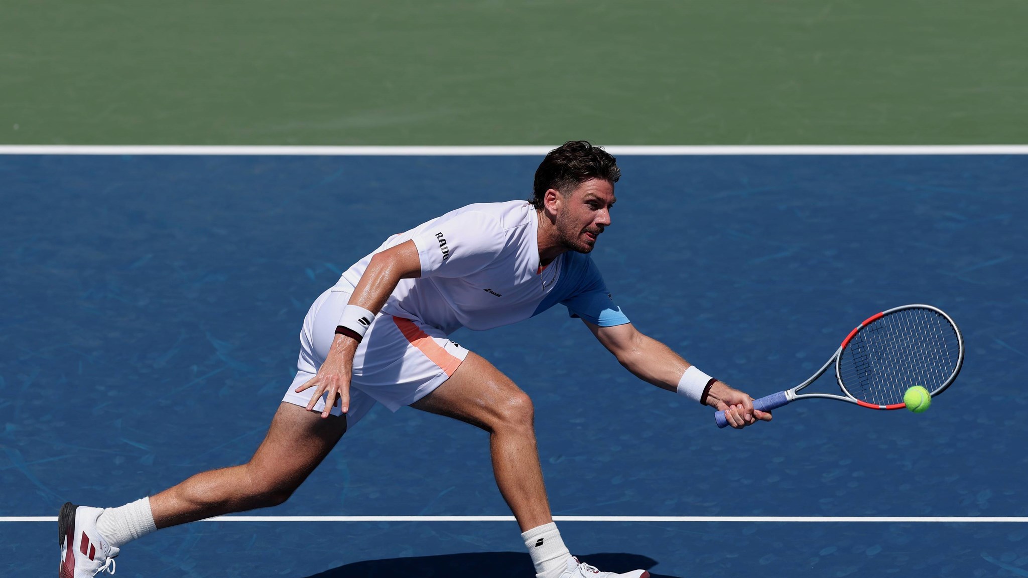 Cam Norrie stretches to hit a forehand in the first round of the 2025 US Open